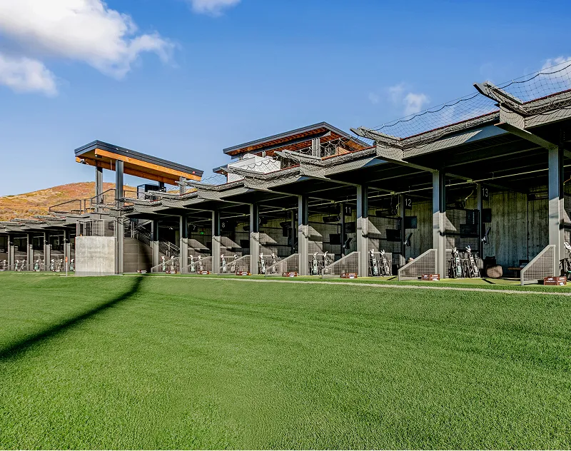 Toptracer golf hitting bays and clubhouse exterior at ParOne