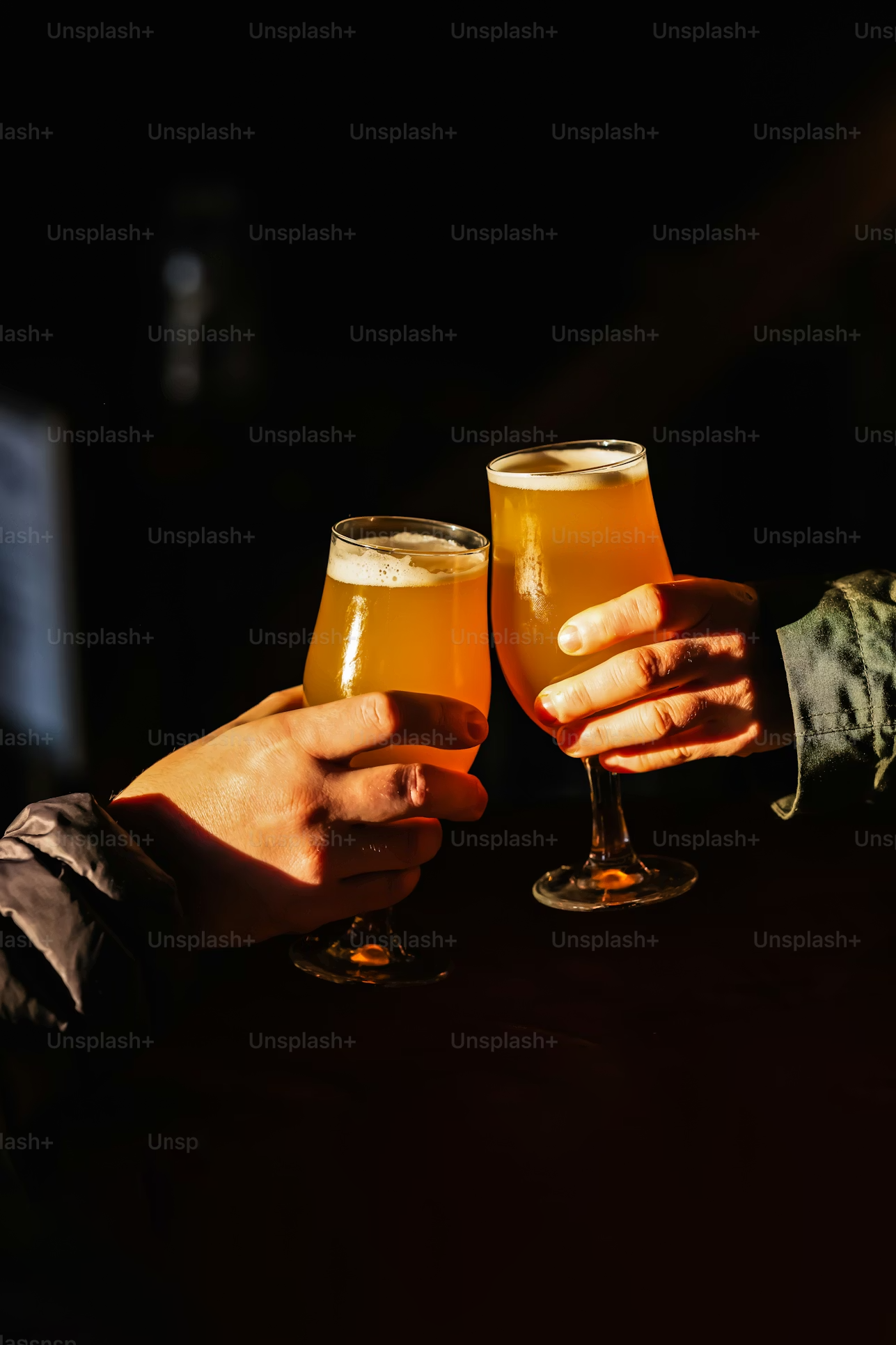 Two people toasting drinks inside a clubhouse setting