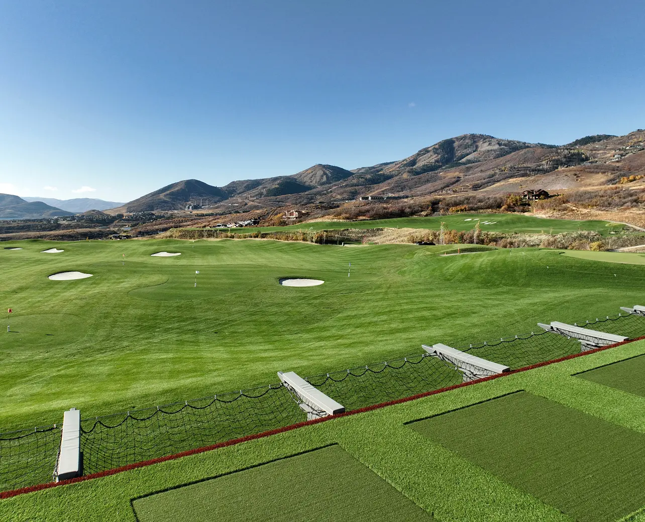 Golf practice range with targets and mountain views at ParOne at SkyRidge